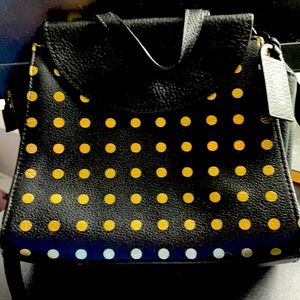 Black and gold Kate Spade Saturday crossbody bag
